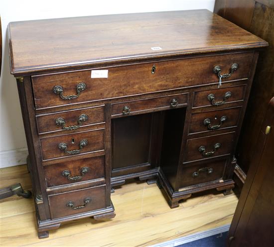 A mahogany kneehole desk, W.86cm